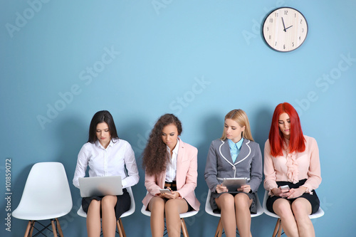 Young businesswomen sitting...