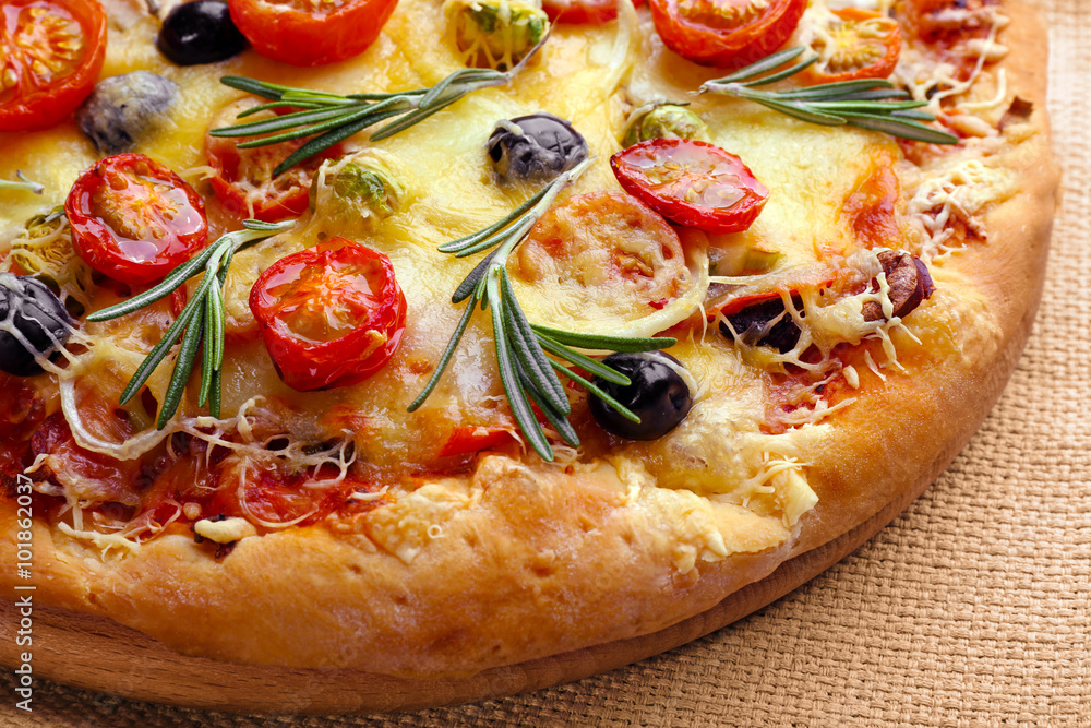 Delicious fresh pizza on napkin closeup Delicious fresh pizza on napkin closeup