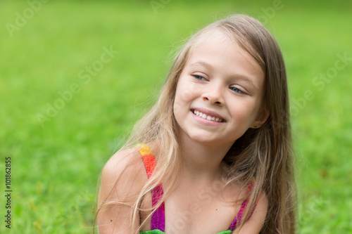 Little blond girl looking to the side