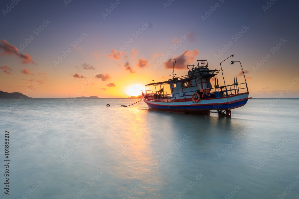 Fishing boat stand at sunrise beach in Phuket
