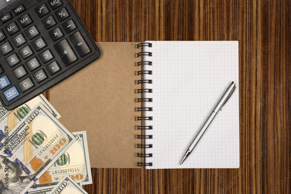 Money, calculator, notepad and pen on wooden background Money, calculator, notepad and pen on wooden background