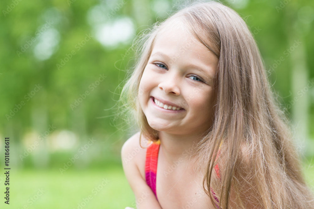 Cheerful little girl in the park Cheerful little girl in the park