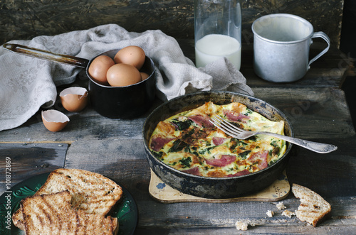 Country breakfast - frittata in a pan and toast.