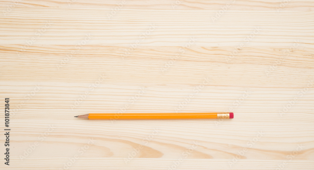 Obraz premium Yellow pencil on wooden table