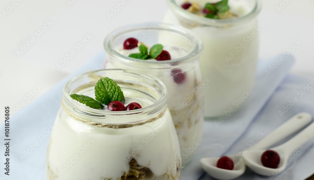 Healthy breakfast - yogurt with oatmeal and berries diet concept. Selective focus. Healthy breakfast - yogurt with oatmeal and berries diet concept. Selective focus.
