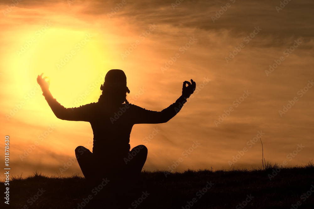 Silhouette of the girl who practice yoga sunset