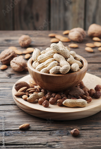 Mix of different nuts on the wooden table