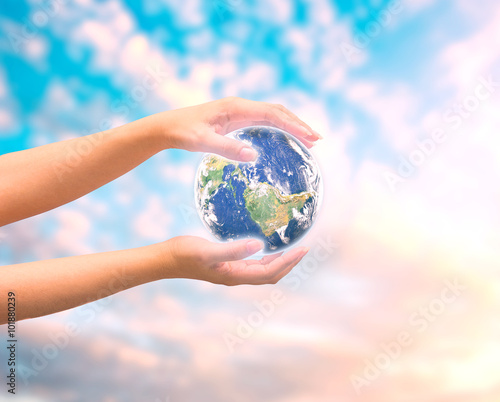 Human hand holding Earth planet. Elements of this image are furn