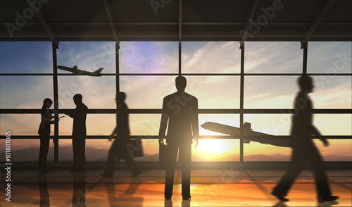 Business man standing and business group silhouette in the airport 