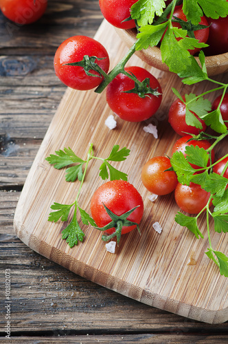 Fresh red tomato with green parsley