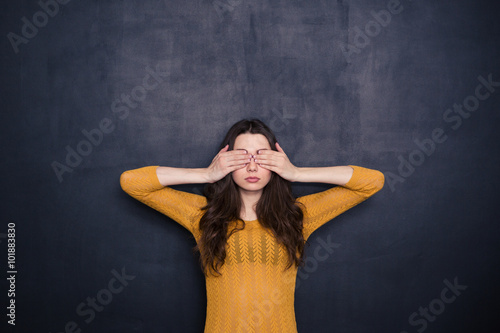 Young woman covering her eyes