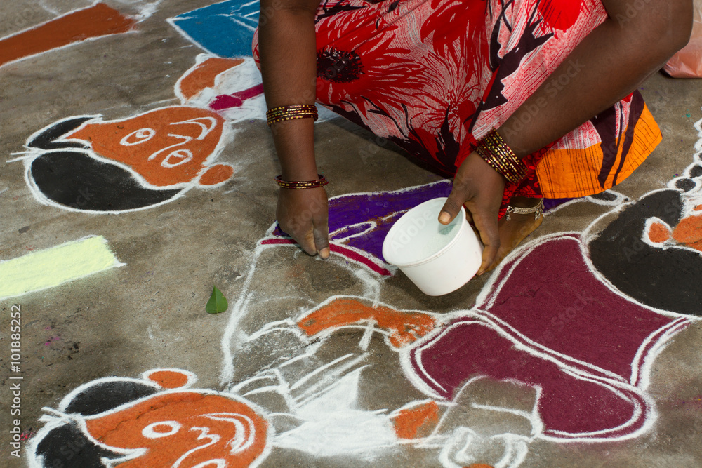 Fotografie Woman drawing Rangoli