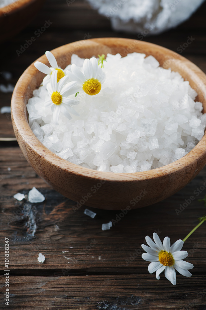 Concept of spa treatment with salt and daisy Concept of spa treatment with salt and daisy