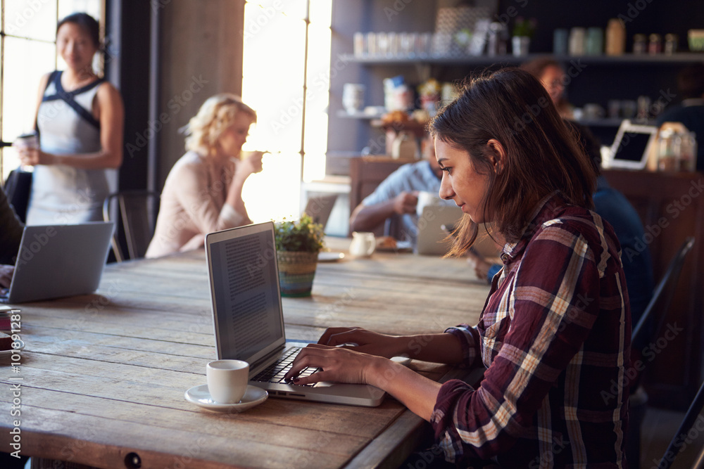 Interior Of Coffee Shop With Customers Using Digital Devices Interior Of Coffee Shop With Customers Using Digital Devices