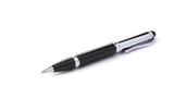 Black ballpoint pen on a white background, shallow DOF