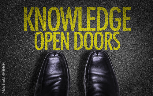 Top View of Business Shoes on the floor with the text: Knowledge Open Doors