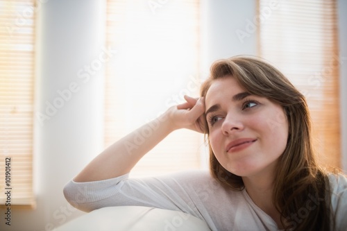 Smiling woman posing on the couch