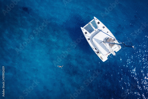 Catamaran in open sea - aerial / drone view