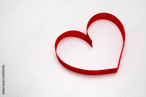 Red ribbon in heart shape Valentines day concept