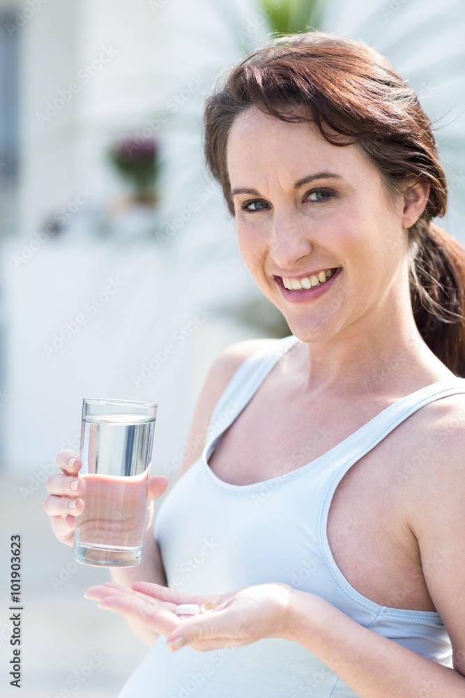 Woman holding glass of water Woman holding glass of water