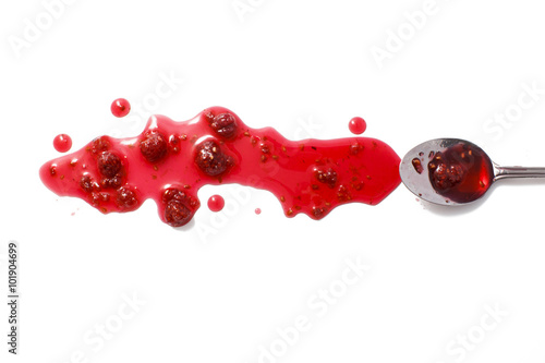 splashes of raspberry jam and a spoon with crimson jam. raspberry jam and raspberries isolated on white background. flat lay, top view