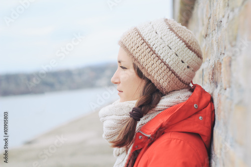 Young thoughtfull woman in winter