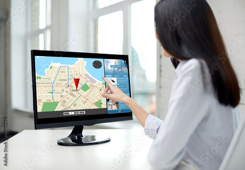 close up of woman with navigator map on computer © Syda Productions