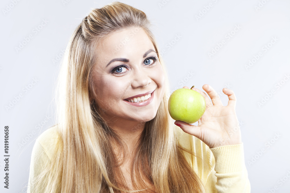 Smiling girl with green apple. Broad smile. Healthy teeth
Smiling girl with green apple. Broad smile. Healthy teeth
