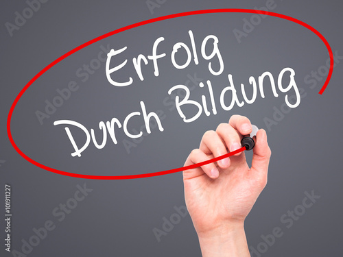 Man Hand writing Erfolg Durch Bildung  (Success Through Training