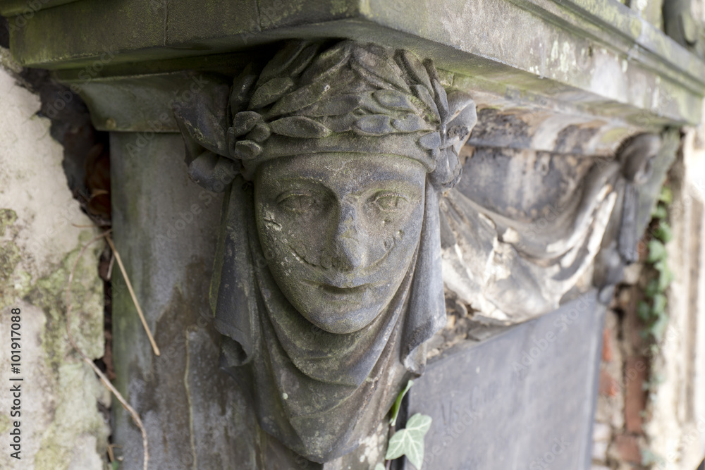 Obraz premium Statue from the mystery old Prague Cemetery Olsany, Czech Republic