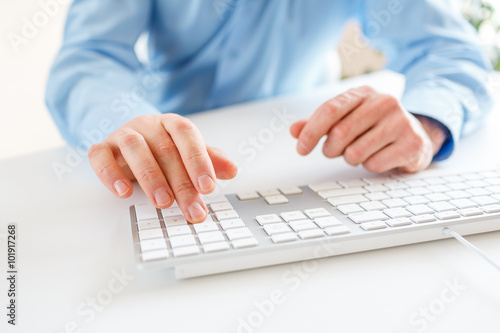 Men office worker typing on the keyboard