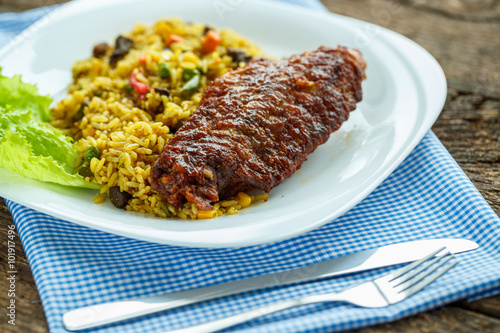 Delicious dishes from turkey meat with rice and salad leaves