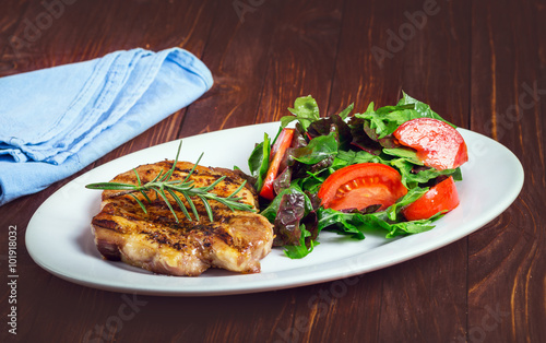 Grilled steak meat with salad from baked pepper