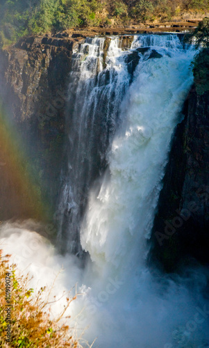 Fototapeta Victoria Falls. A general view of a rainbow. National park. Mosi-oa-Tunya National park. and World Heritage Site. Zambiya. Zimbabwe. An excellent illustration.