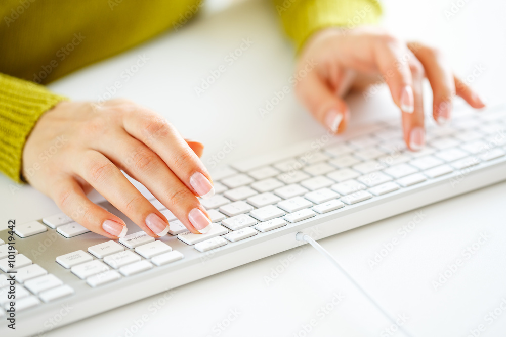 Woman office worker typing on the keyboard Woman office worker typing on the keyboard