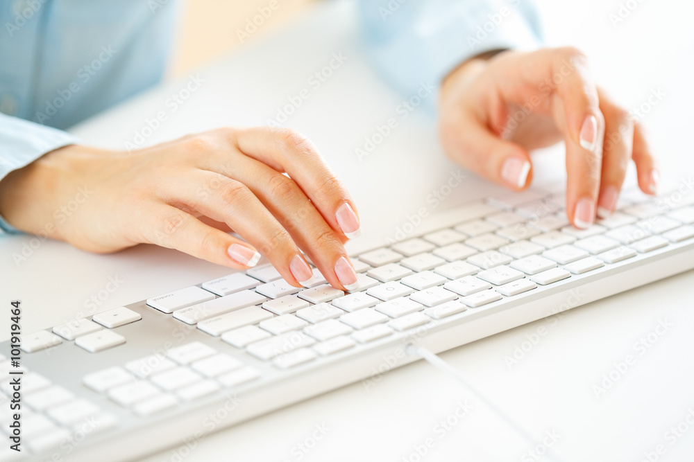 Woman office worker typing on the keyboard Woman office worker typing on the keyboard