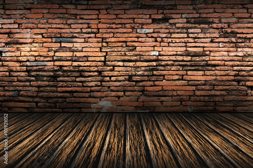 old brick wall and brown wooden floor