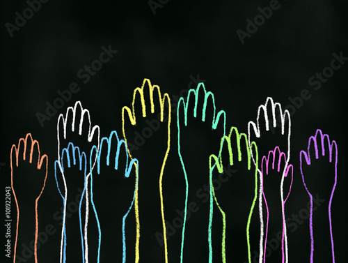 Class Participation - Colored chalk drawing on blackboard of all hands raised up