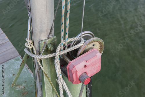 detail of an old boat lift with ropes