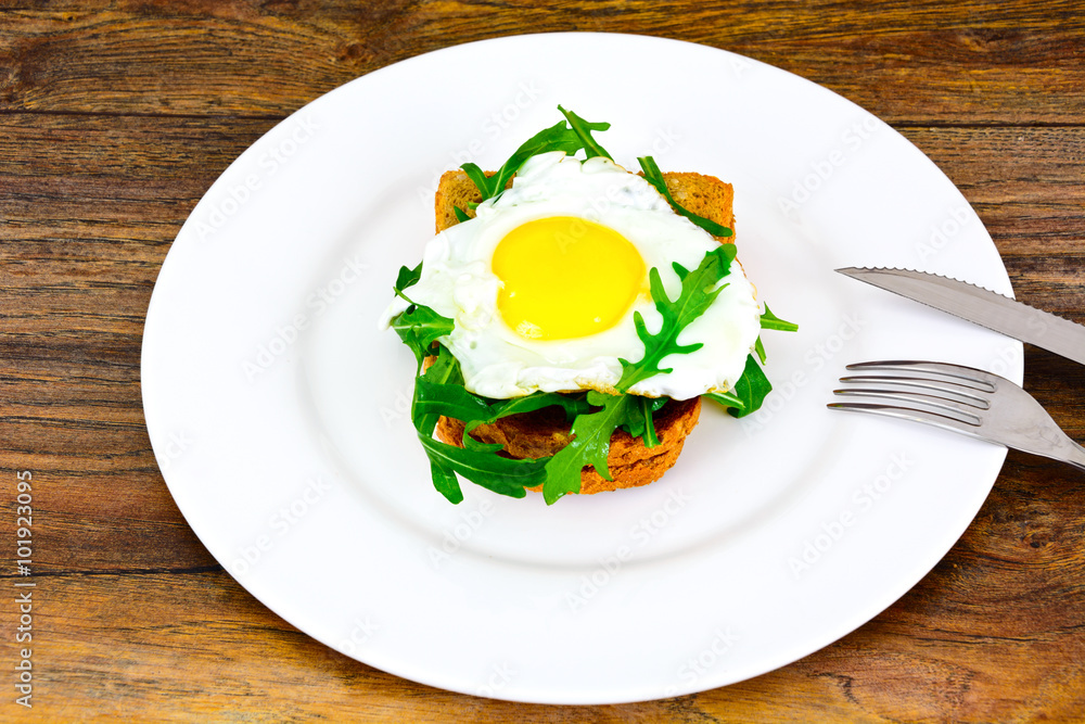 Scrambled Eggs with Arugula on Whole Grain Bread Scrambled Eggs with Arugula on Whole Grain Bread