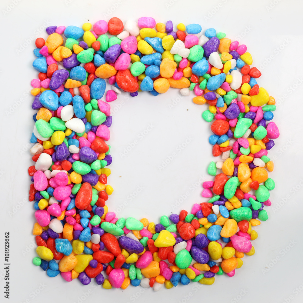 Obraz premium Colored stones arranged in a letter D.