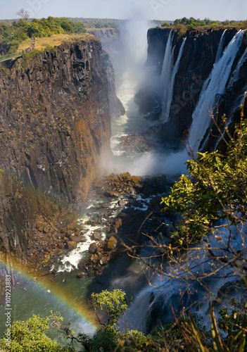 Fototapeta Victoria Falls. A general view of a rainbow. National park. Mosi-oa-Tunya National park. and World Heritage Site. Zambiya. Zimbabwe. An excellent illustration.