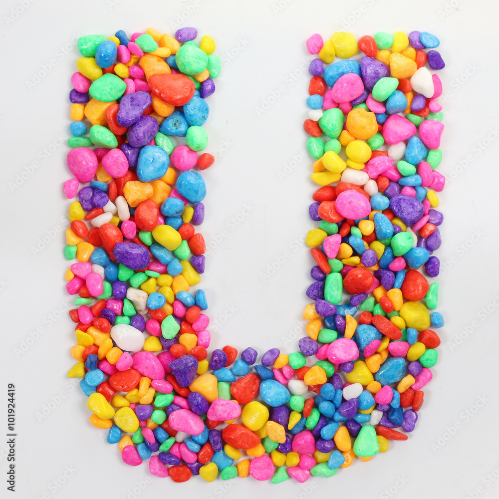 Colored stones arranged in a letter U. Colored stones arranged in a letter U.