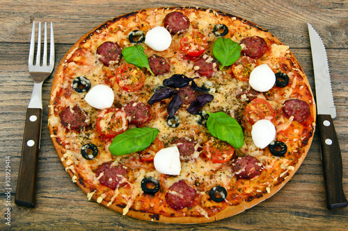 Pepperoni Pizza with Sausage, Cheese, Mozzarella, Olives and Bas