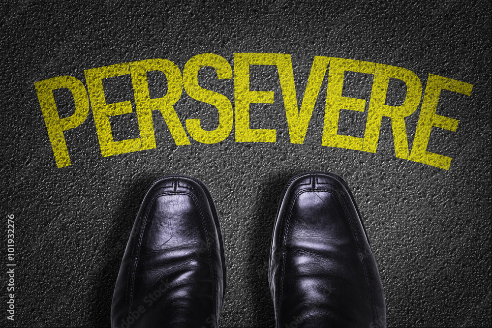 Φωτογραφία Top View of Business Shoes on the floor with the text: Persevere