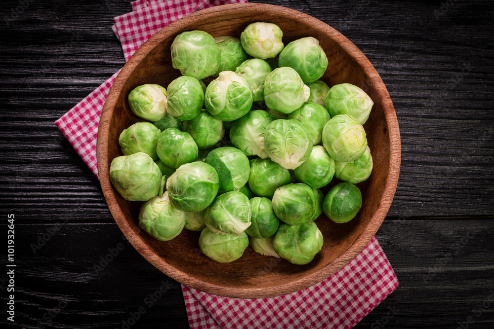 Fresh brussel sprouts over rustic wooden texture.healthy food Fresh brussel sprouts over rustic wooden texture.healthy food