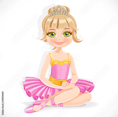 Beautiful ballerina girl in purple dress and tiara sit on floor