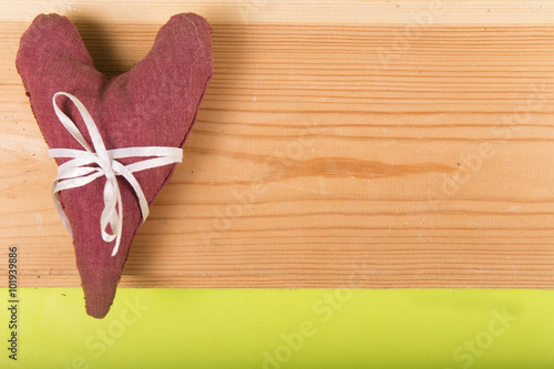 heart made of cloth on a wooden background