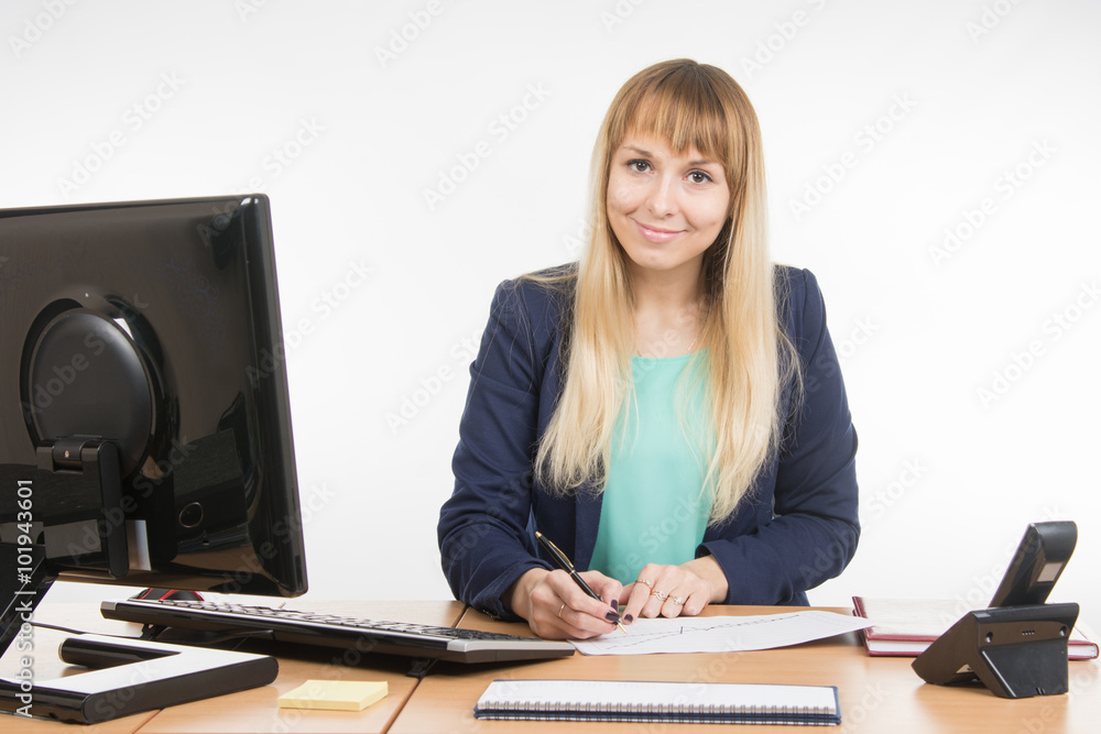 Business woman studying charts on a paper document Business woman studying charts on a paper document