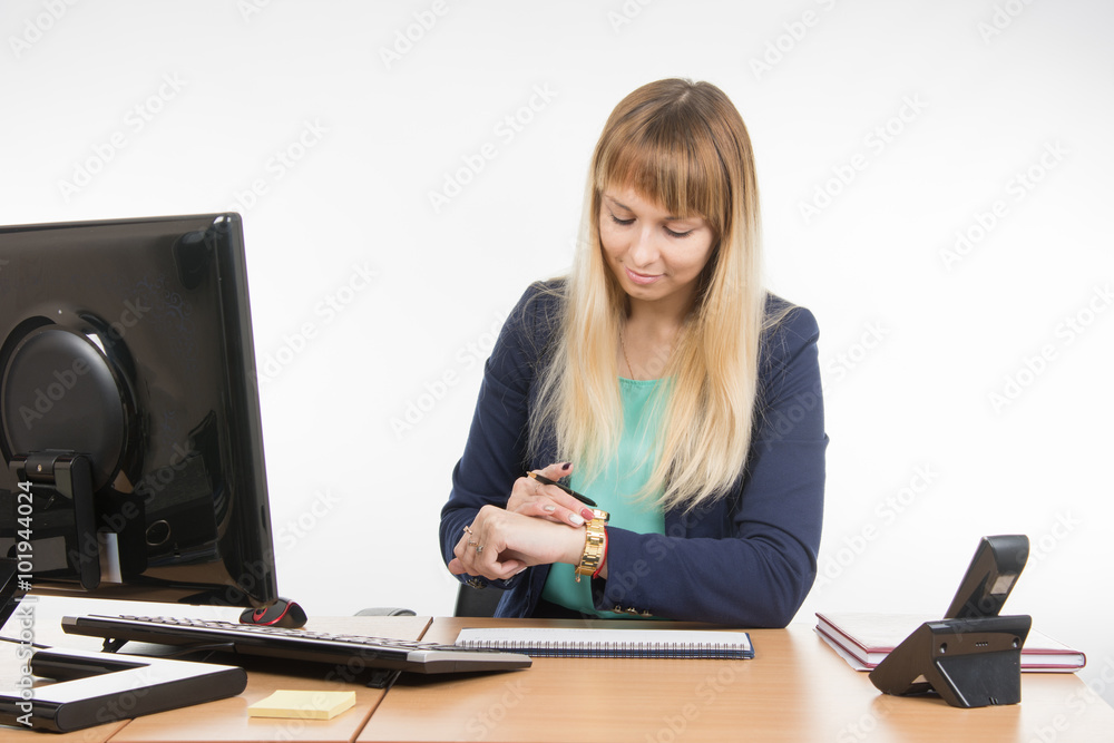 Business woman looked at his watch waiting for the client in the office Business woman looked at his watch waiting for the client in the office